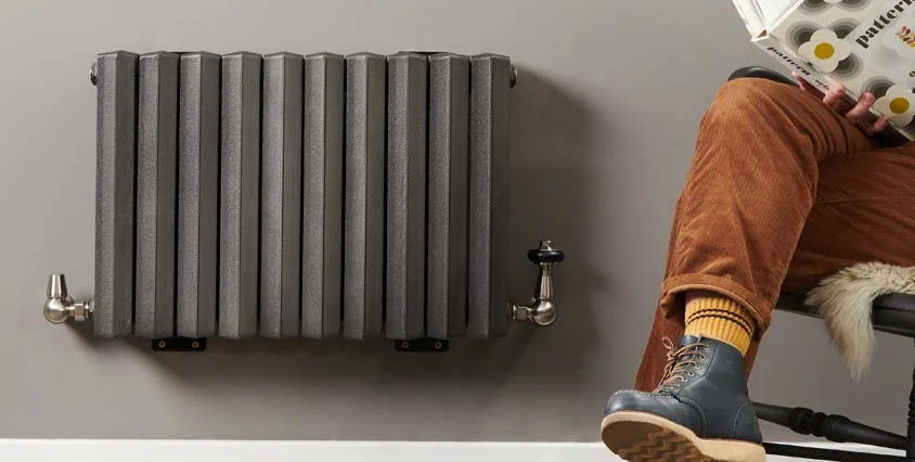 Castrads Vulcan wall-hung cast iron radiator in a grey etch-coated polish finish