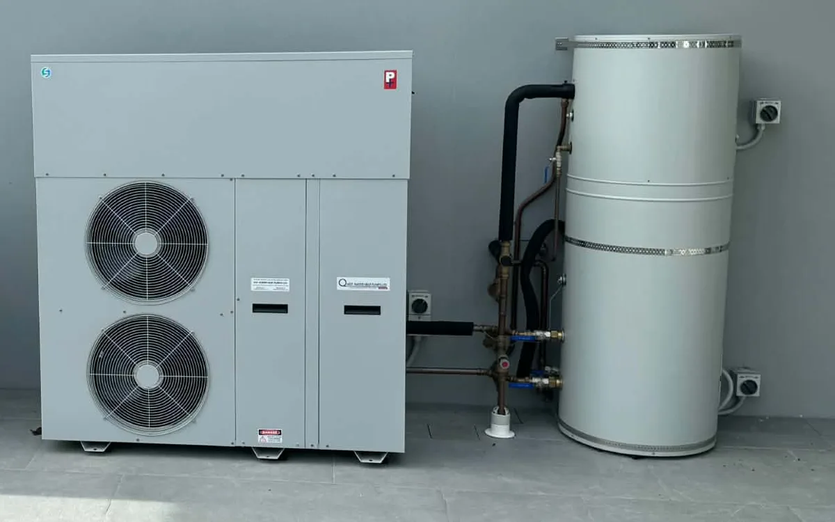 DuoHeat heat pump with the hot water cylinder fitted outside beside it