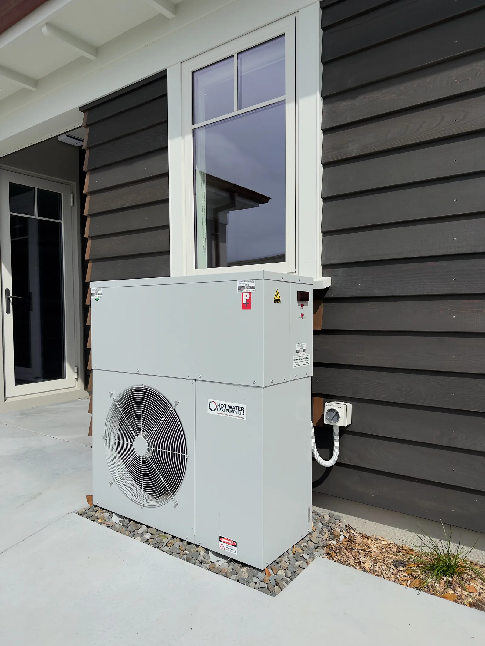 Air-to-water heat pump installed outside a new Auckland home