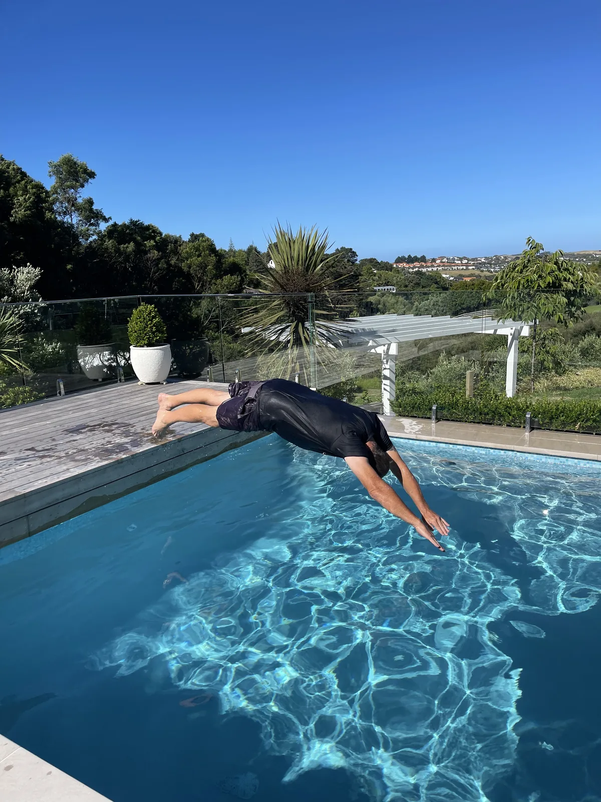 Diving into a heated pool in Auckland