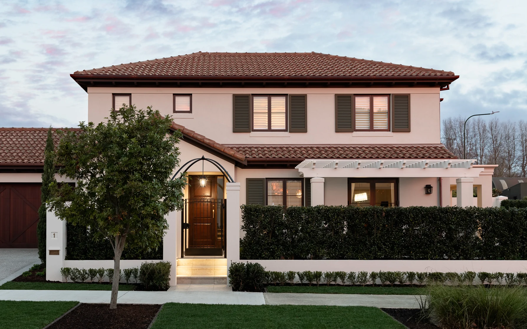 Facade at evening — hydronic underfloor heating by Champion Heating