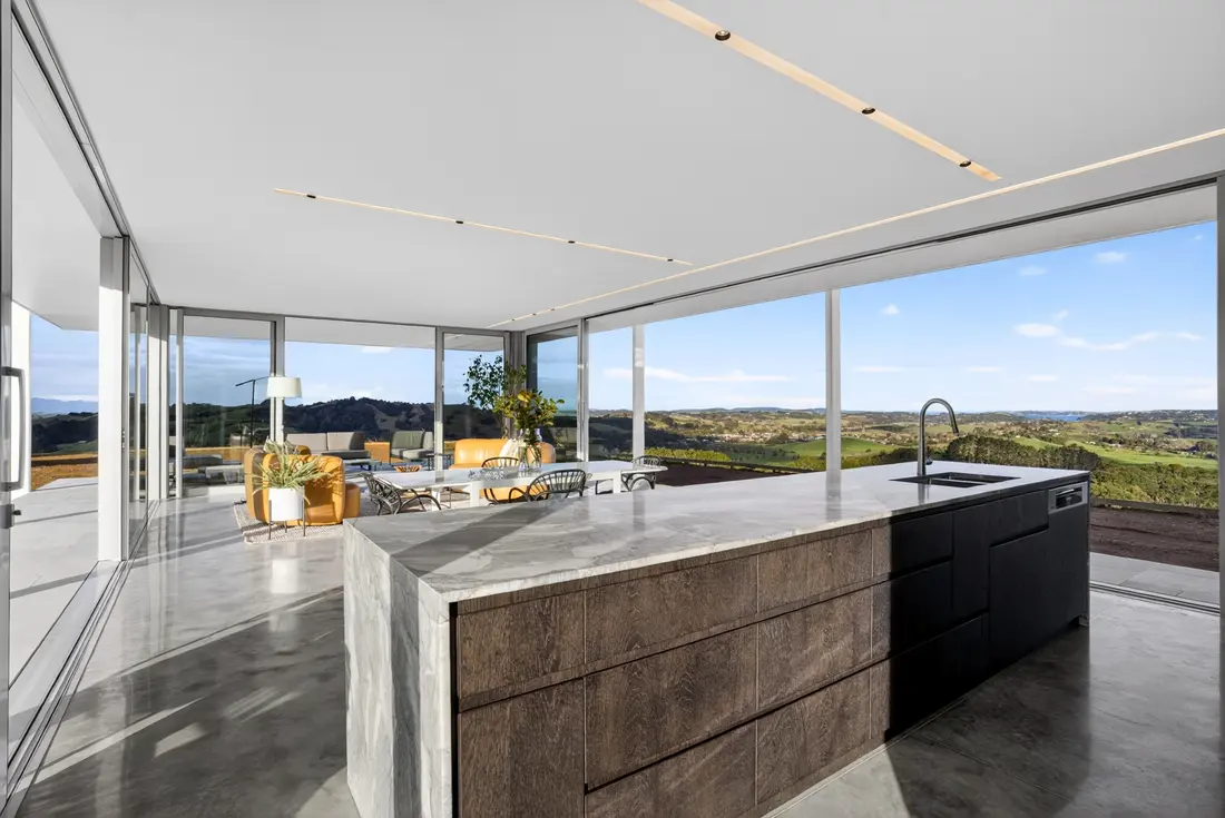 Kitchen island with the heated concrete floor running through to the living area